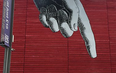 Illustrated finger pointing downwards