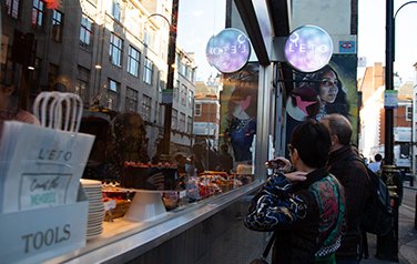 Shoppers looking through window